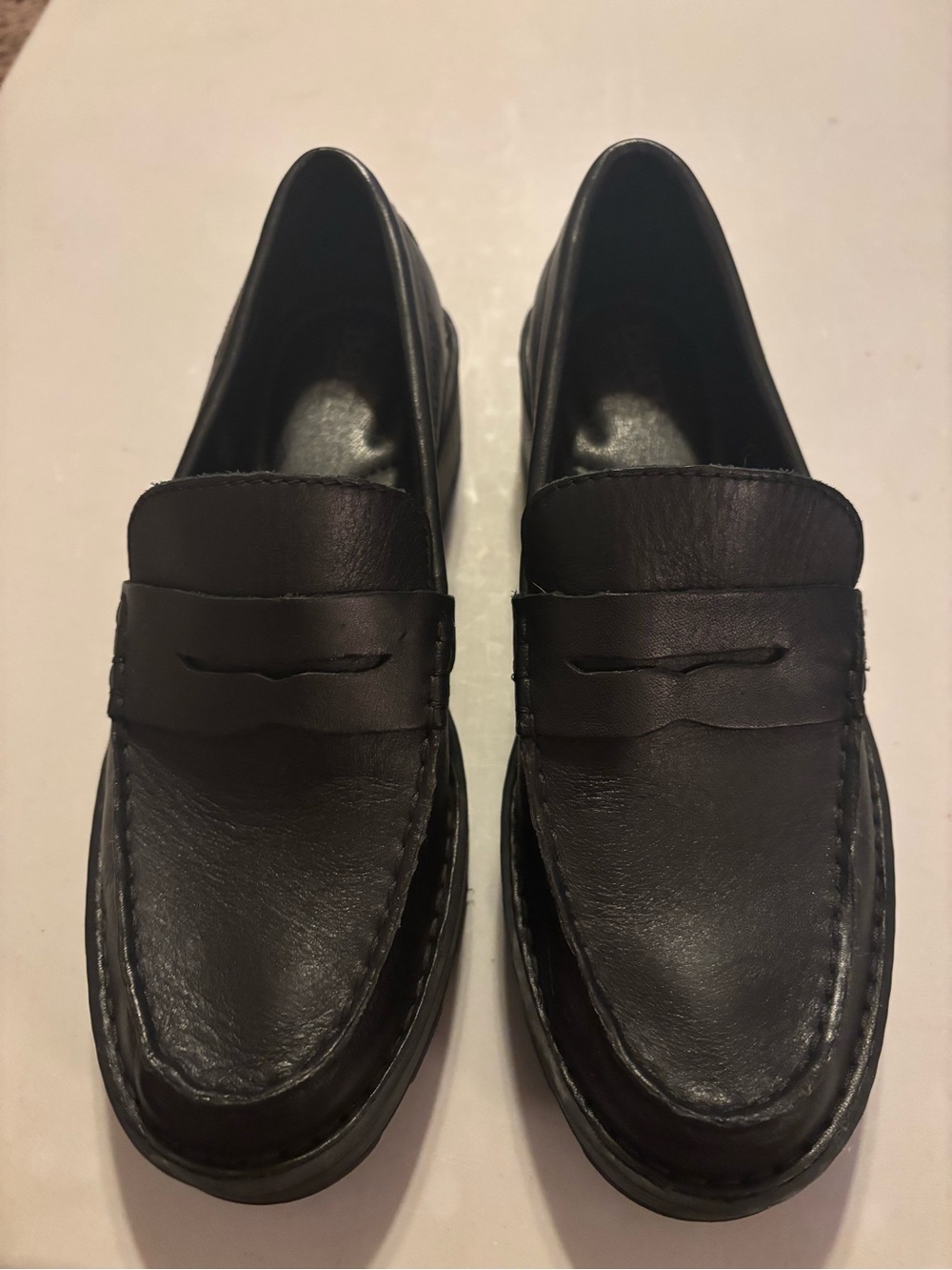 Born Carrera loafers, featuring a classic penny loafer style